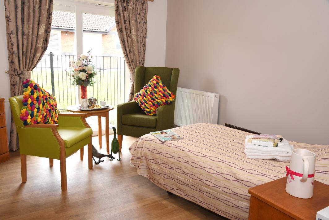 bedroom with two armchairs